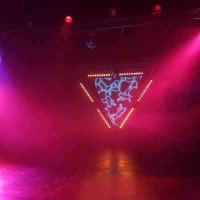 Stage lit with coloured lighting.