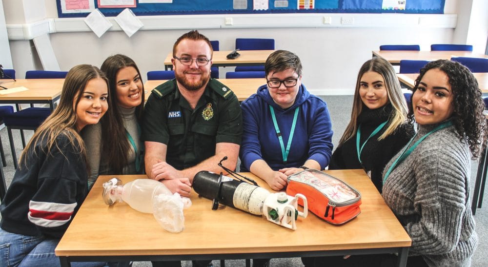 Paramedic James Barry (third from left) with Health & Social Care students (left to right) Chelsea Stokes, Millie Timmins, Ethan Meddoms, Ellie Campbell and Nurell Carter