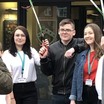 students with mechanical grabbers