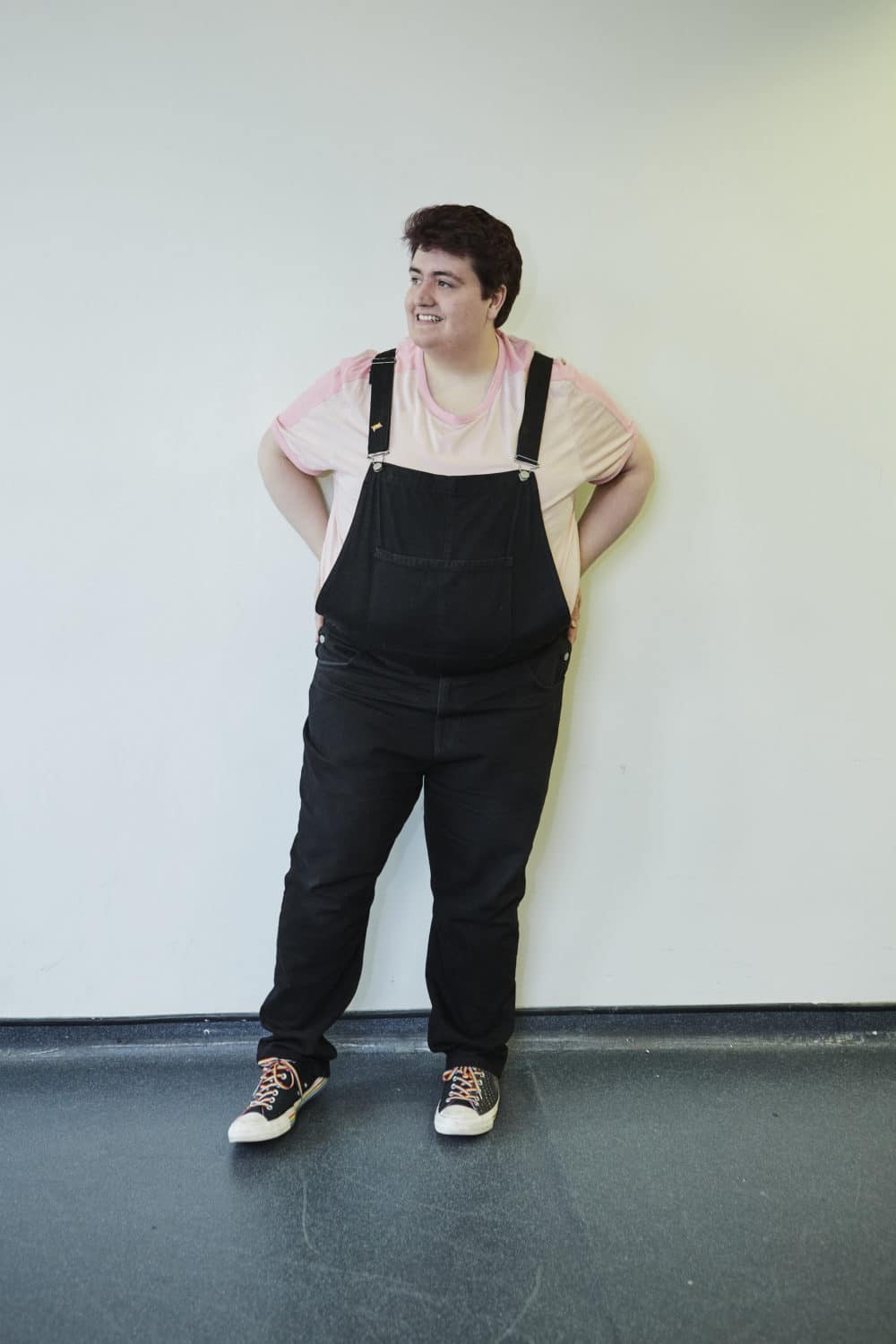 College DJ posing against a wall