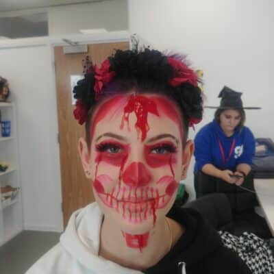 Student has make up on face of red skull