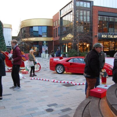 Stratford College Photography Students standing around in front of Ferrari