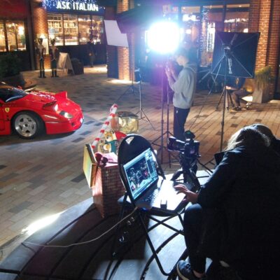 Students setting up cameras to capture ferrari