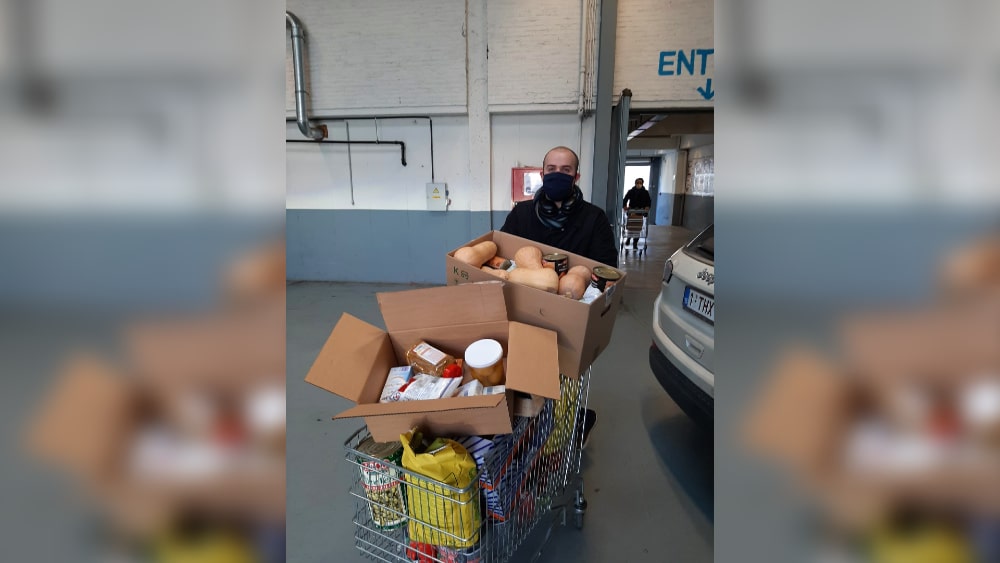 Student pushing trolley full of food
