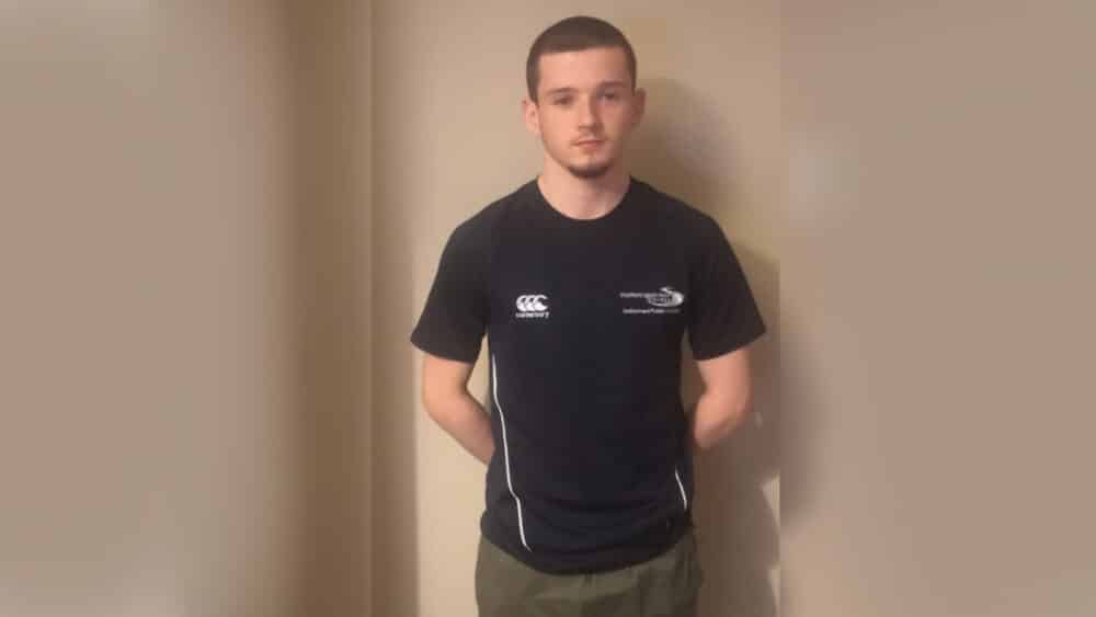 Jack standing in college shirt