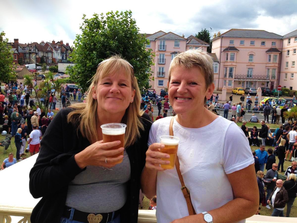 Two women holding drinks