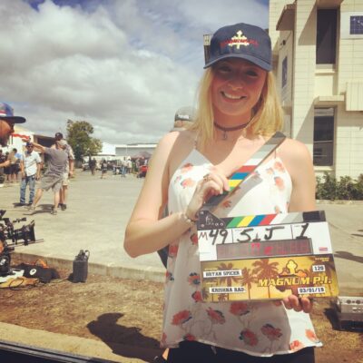 student holding magnum pi clapper board