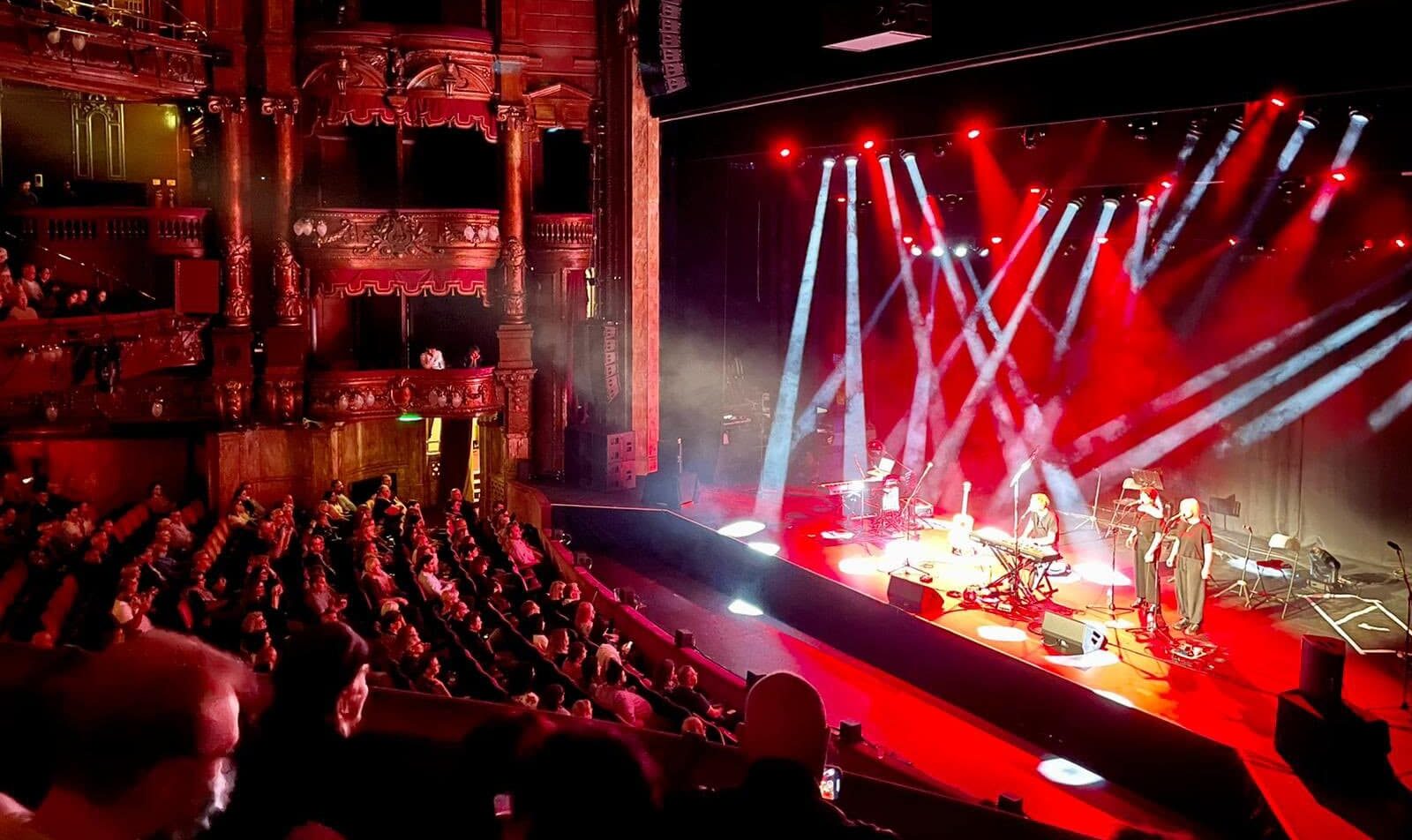 Isaac on stage at the London Palladium college trip