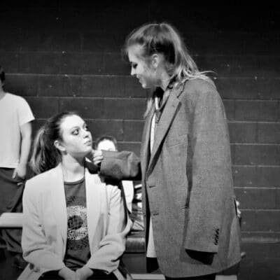 Evie and Chloe in boss scene at stratford college