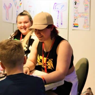 Emily helping student
