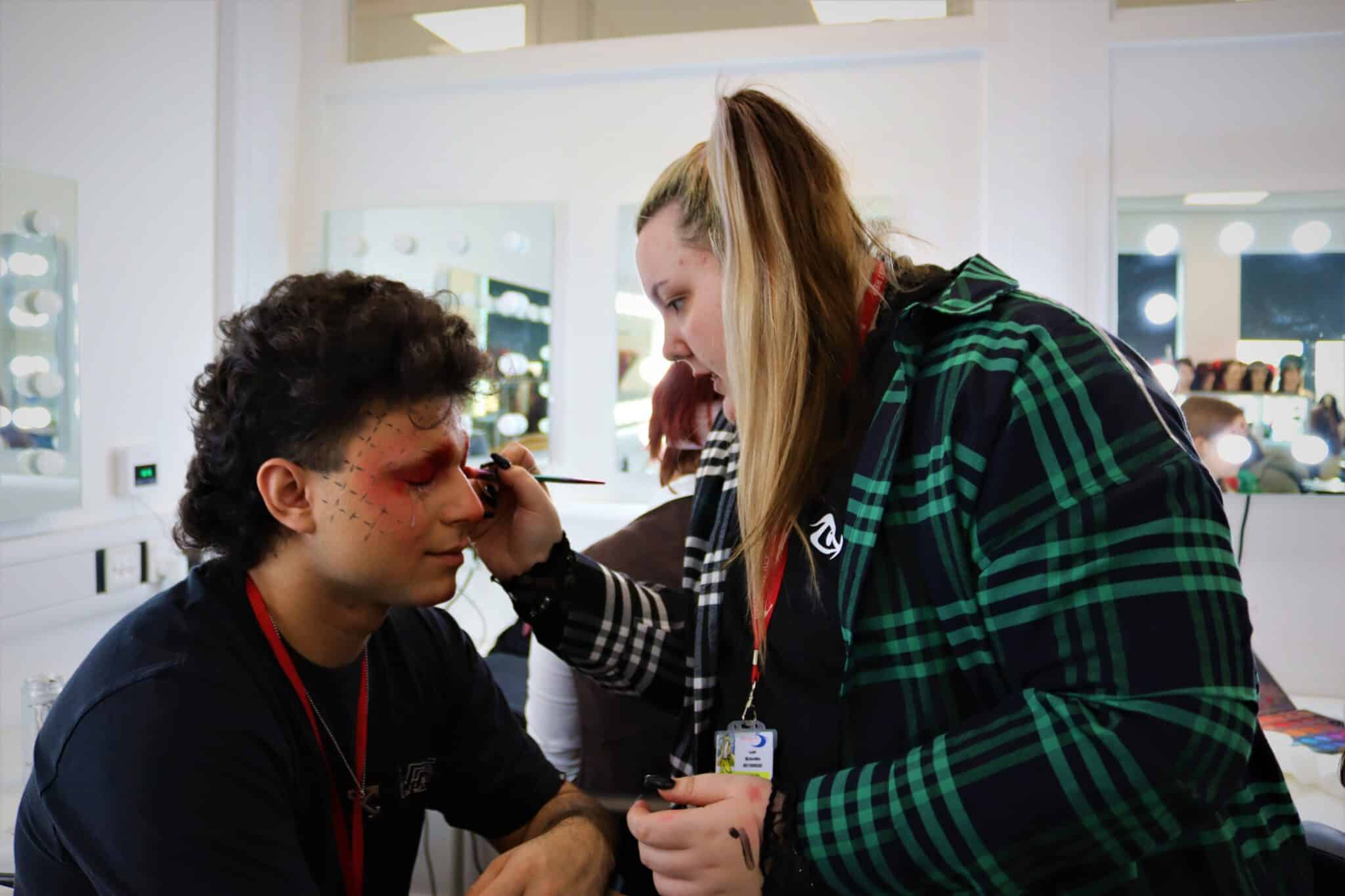 Leah Bickerdike doing make up on model