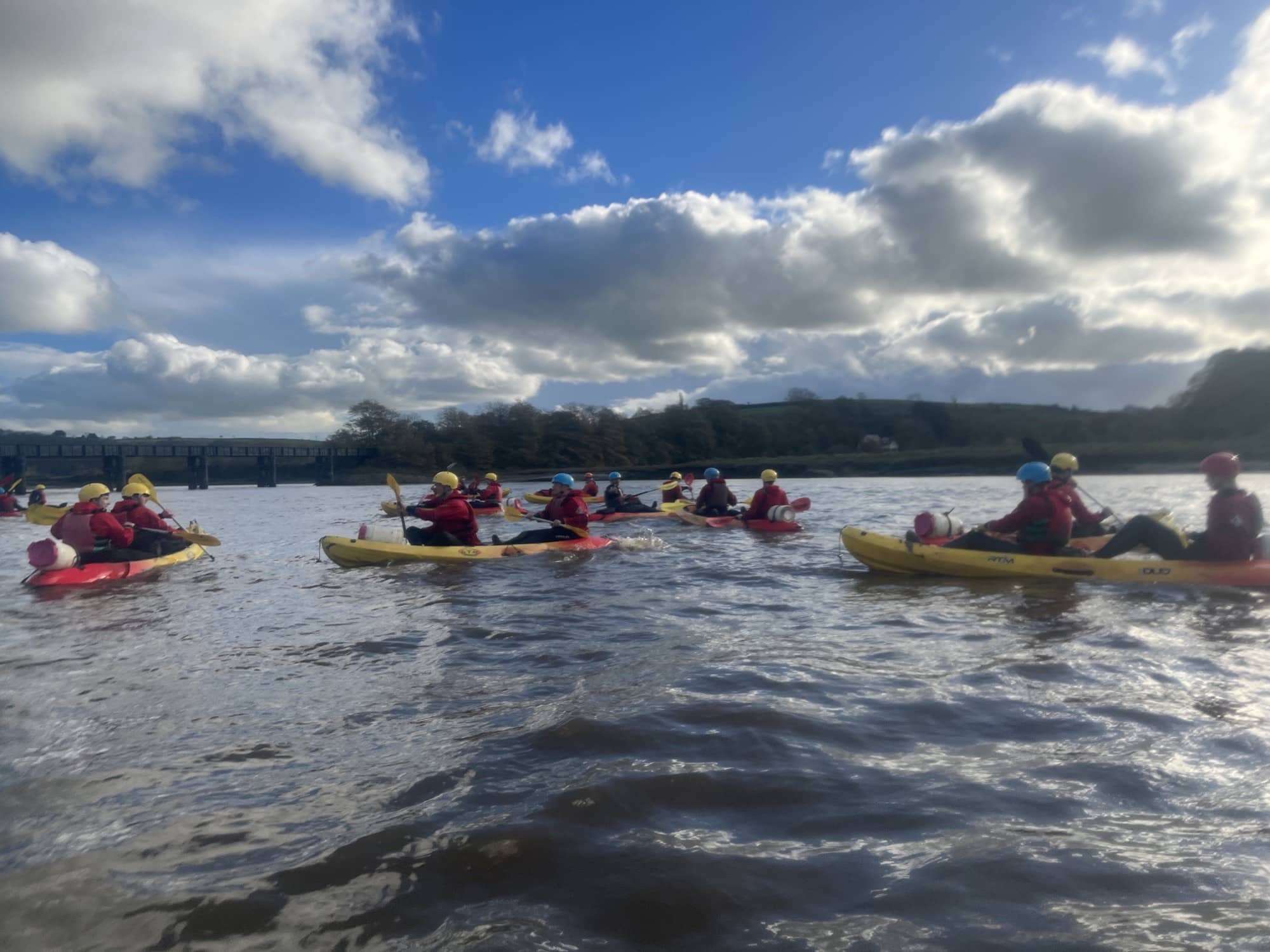 Public Service Students taking on rafting in yellow boats
