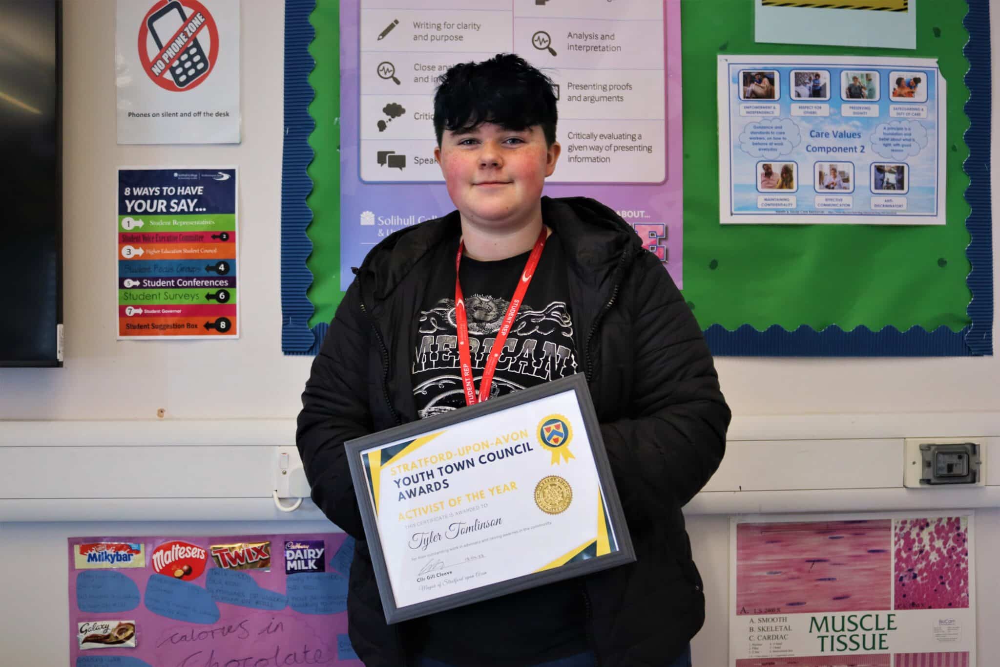 Tyler holding certificate for his nomination