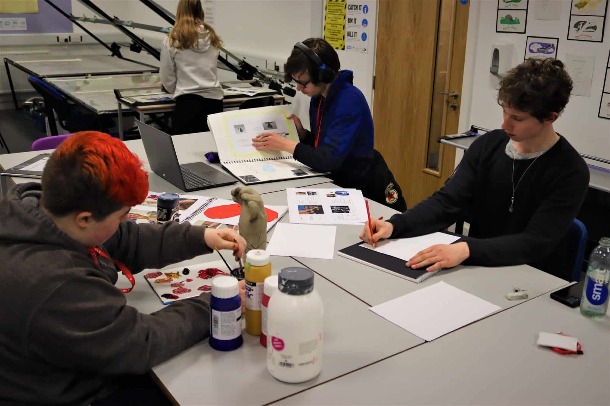 Level 2 Art Students drawing, painting and working on designs