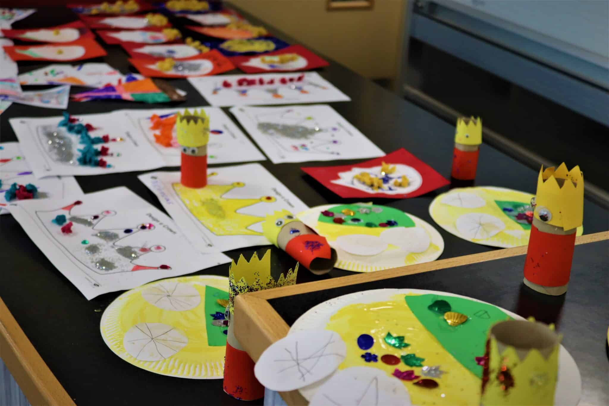 Finished crafts displayed on a table at coronation event with the local community