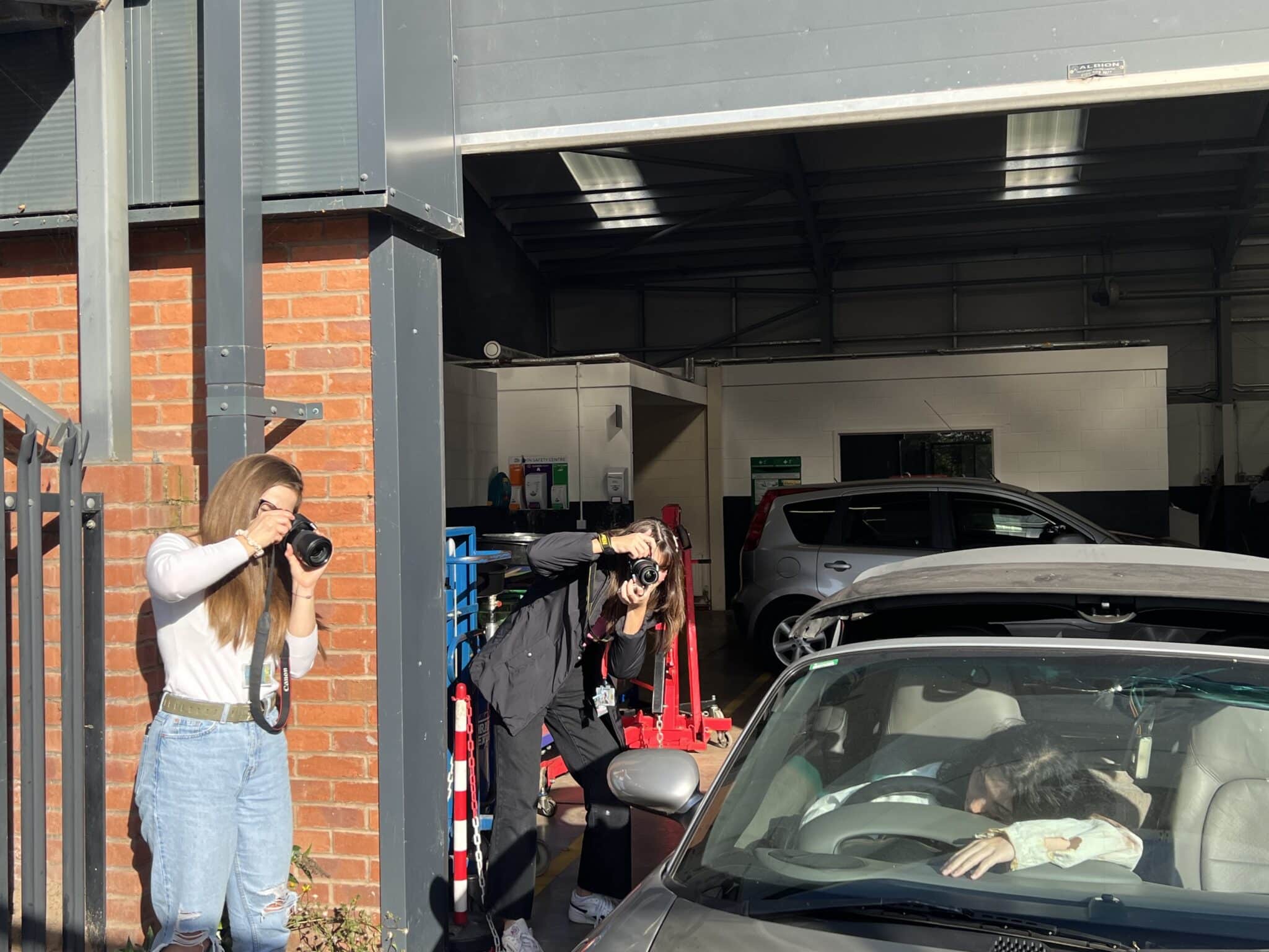 Photography students taking photos of make up students casualty project