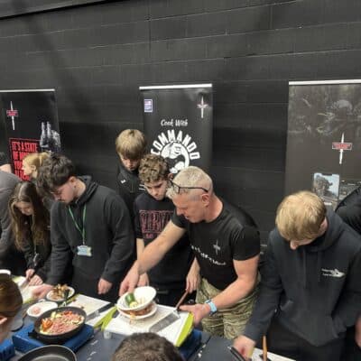 Students stood around cookers