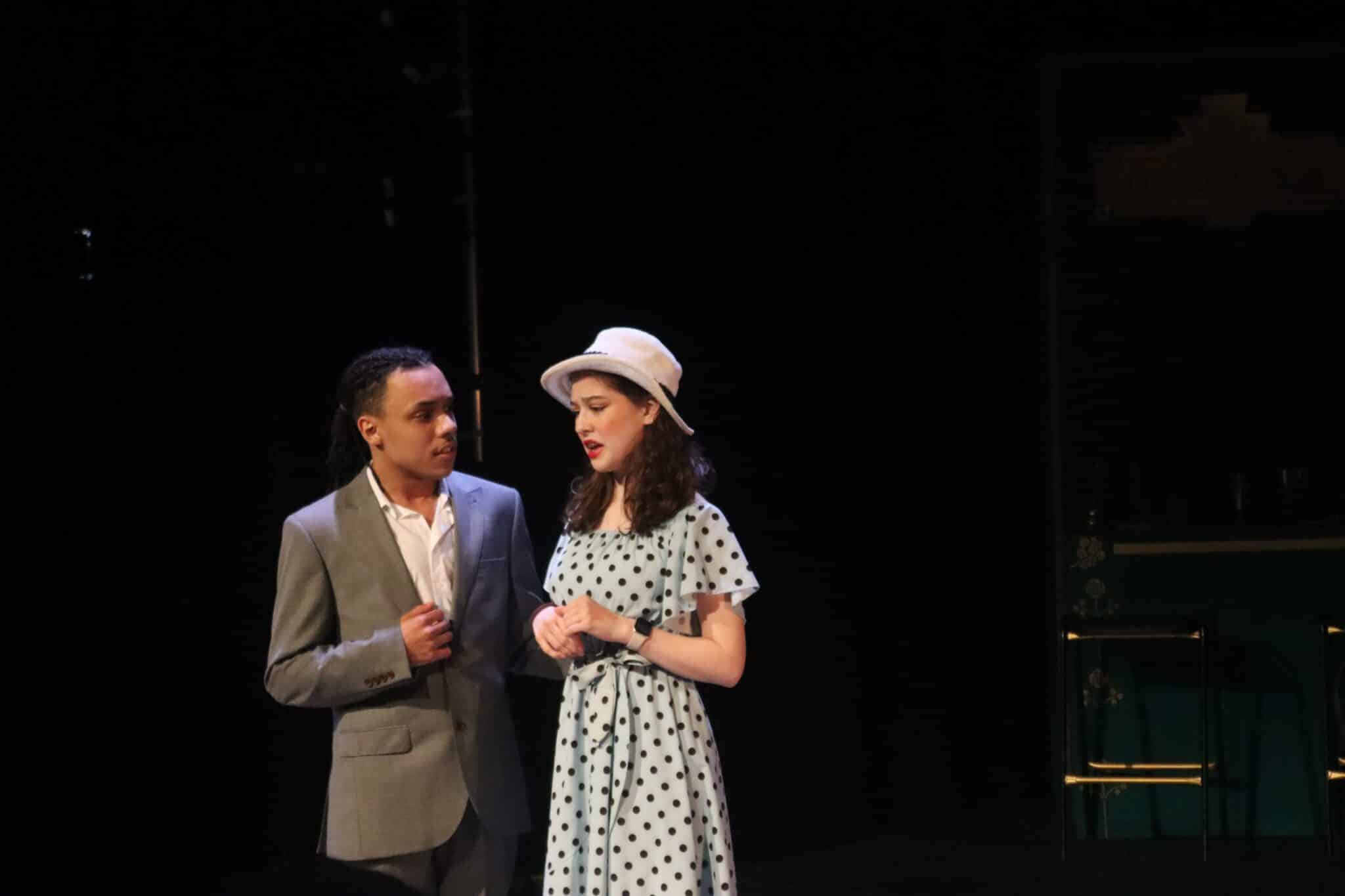 Two people dressd in 1920s clotehs on stage