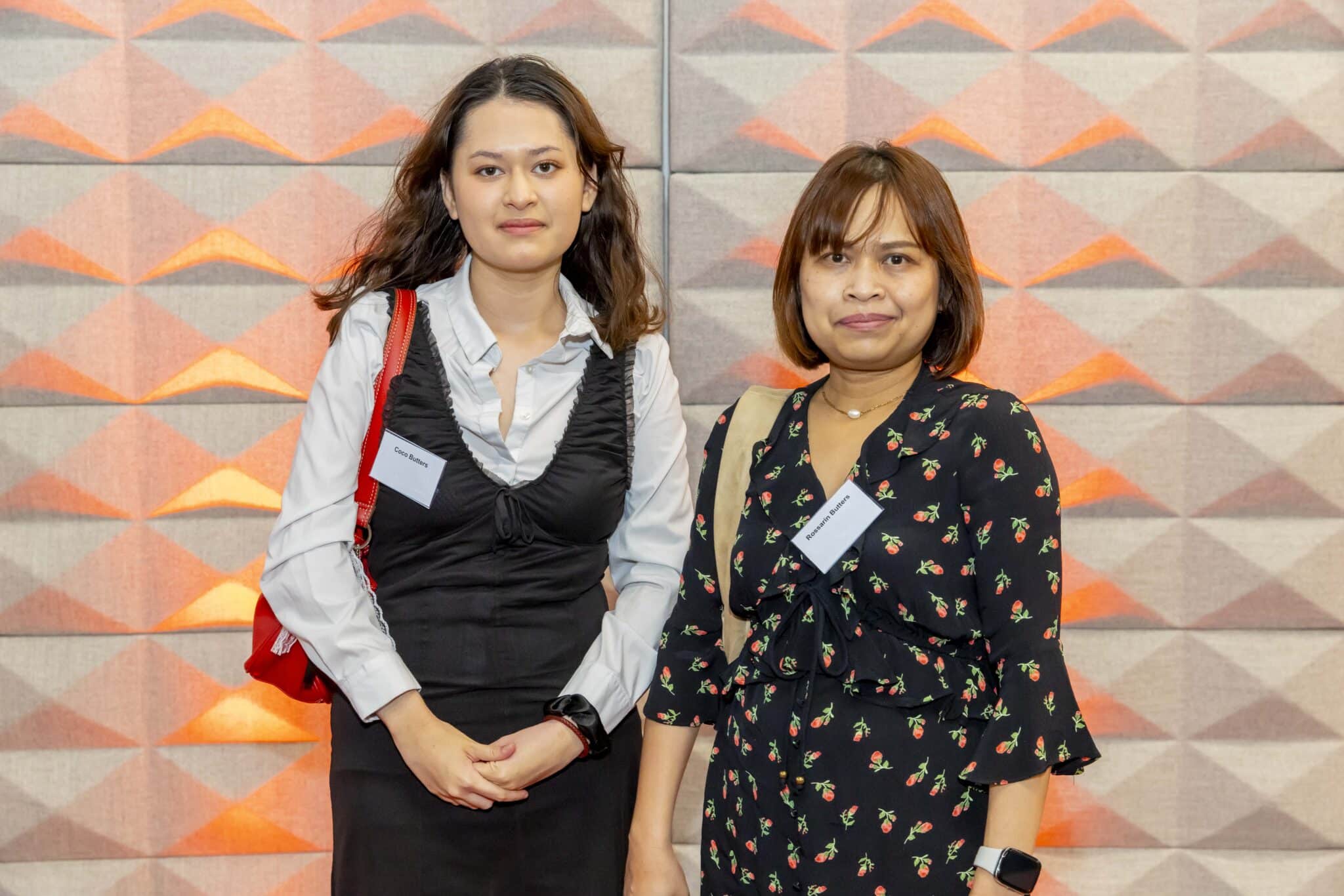 A student and their mum on a red carpet