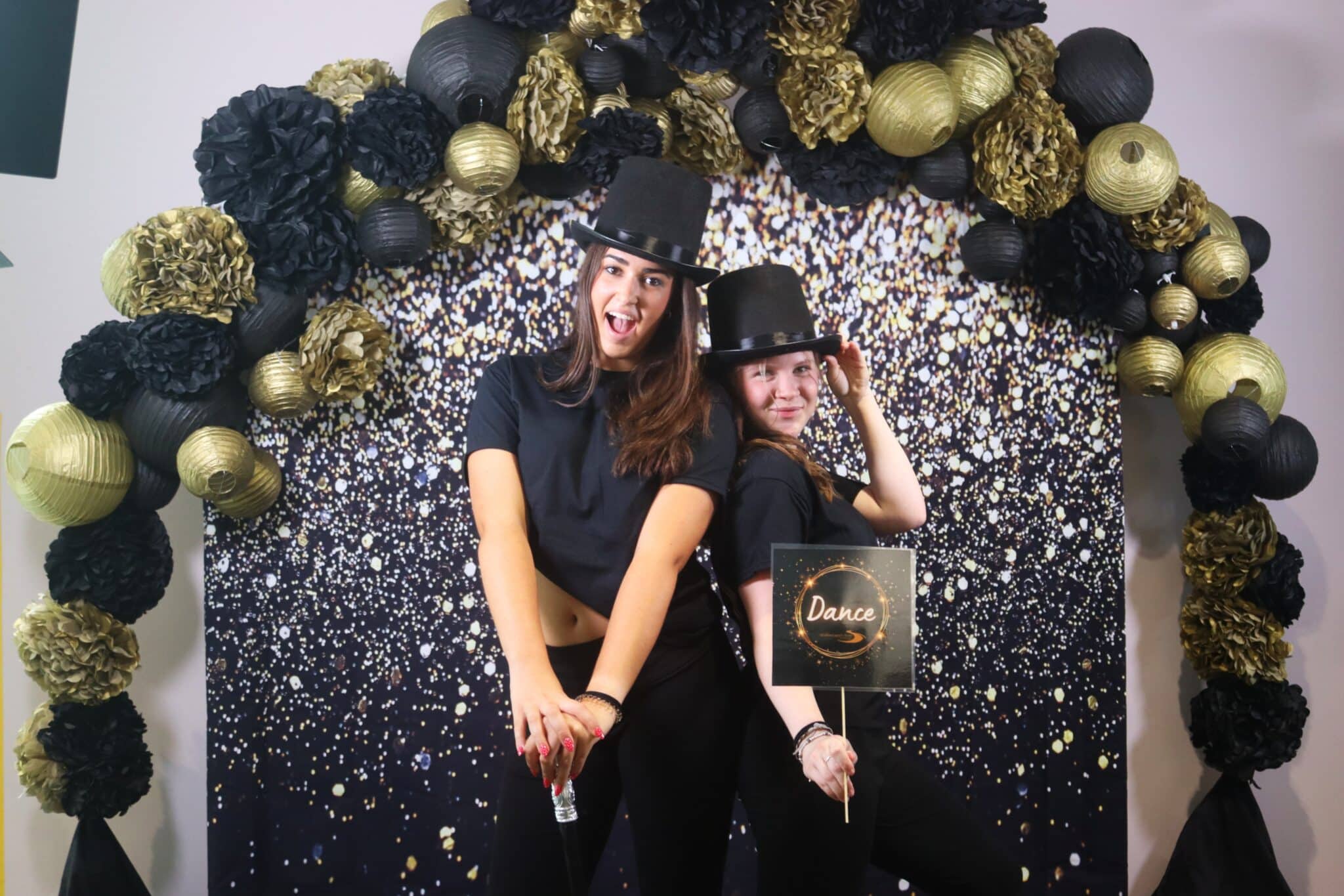 dance students posing for celebratory pictures