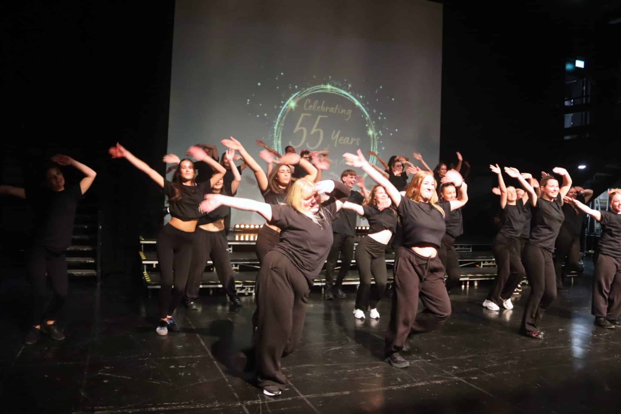 performing arts students performing dance piece