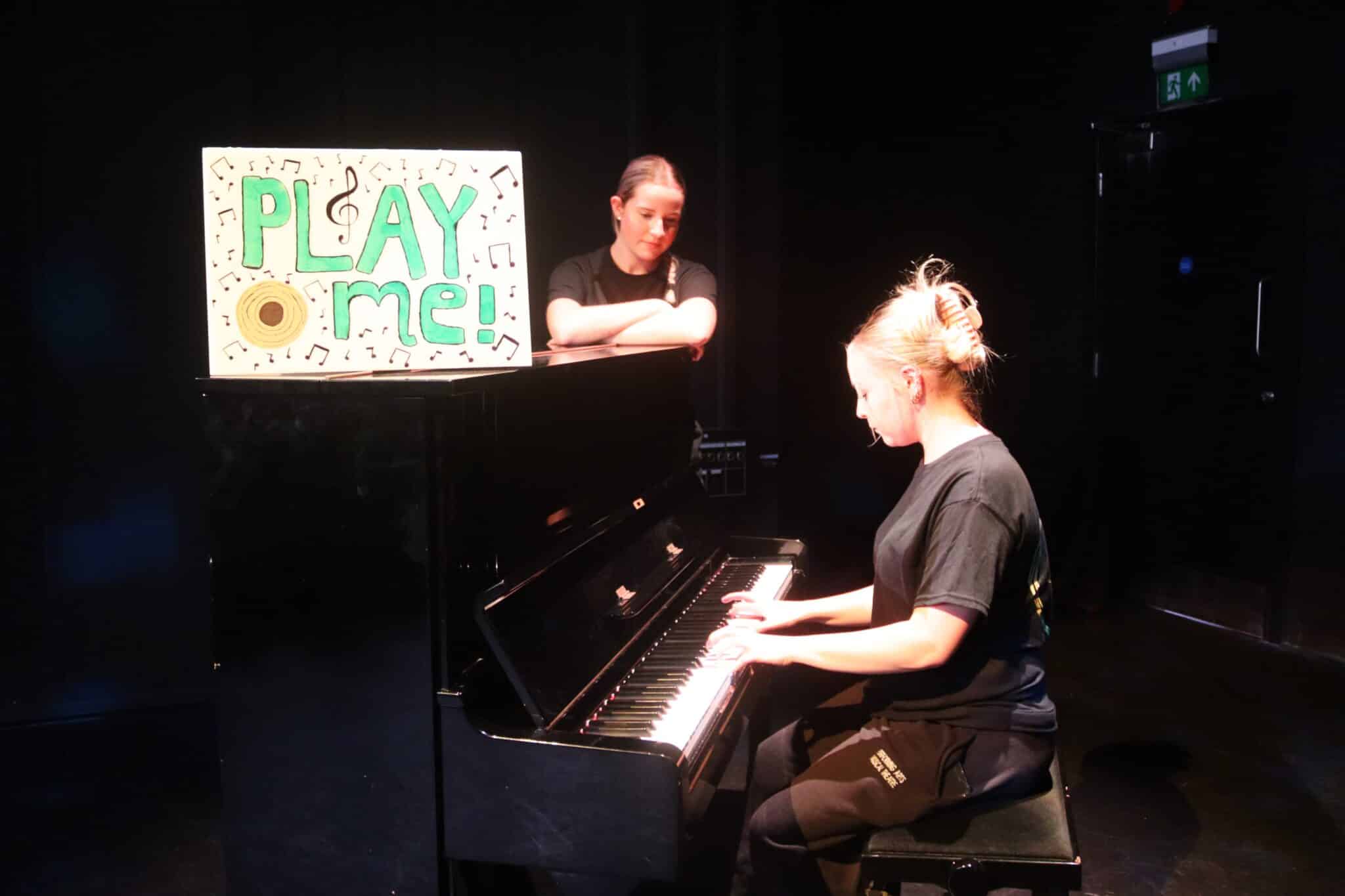 performing arts students playing piano