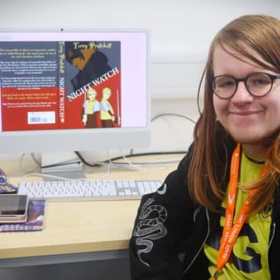 student sat in front of computer