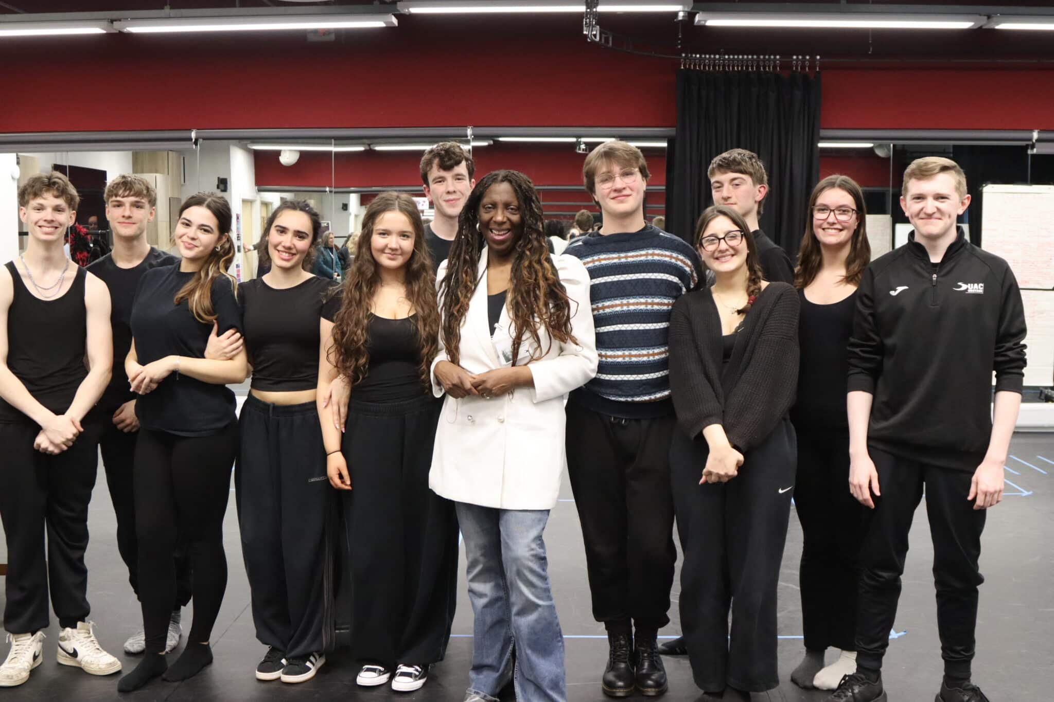 sandra godley surrounded by acting students