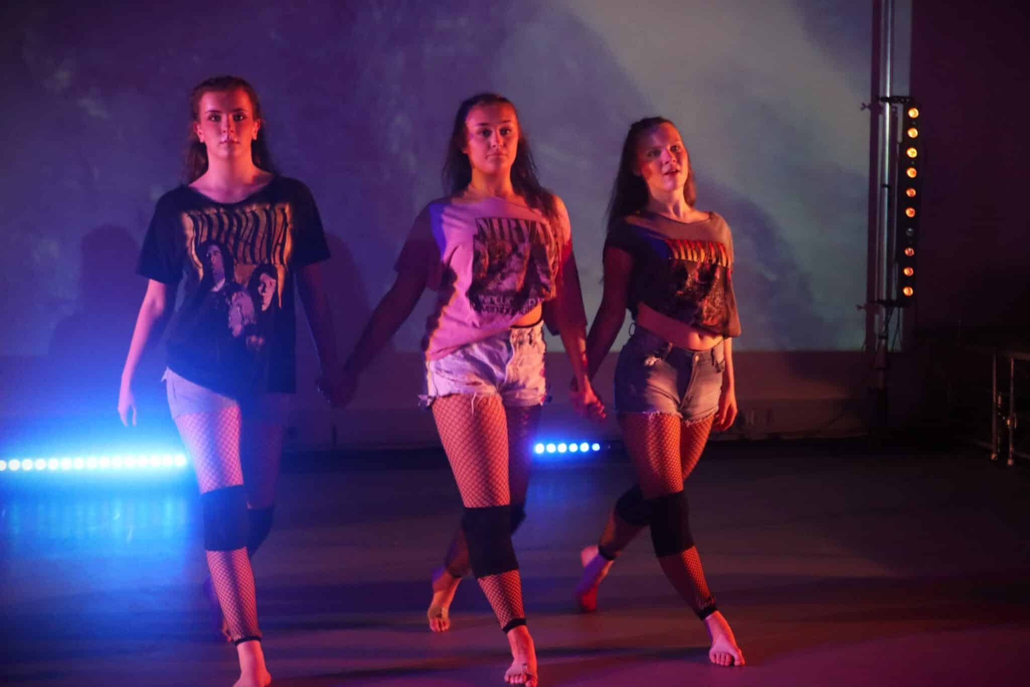 3 Stratford College students performing at Rocking show