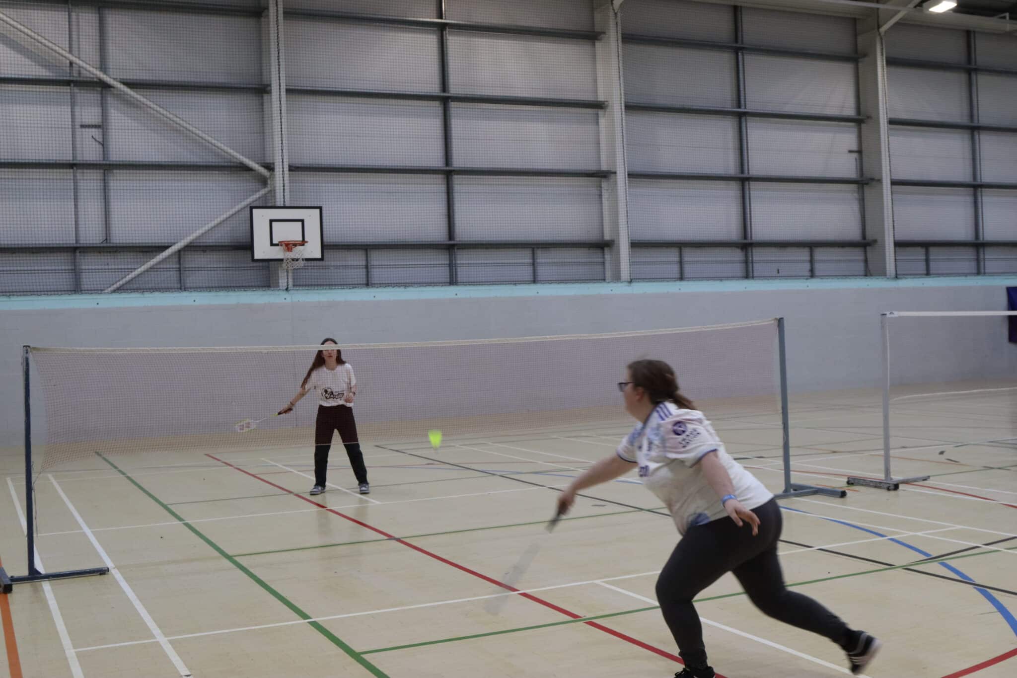 College students competing in Badminton