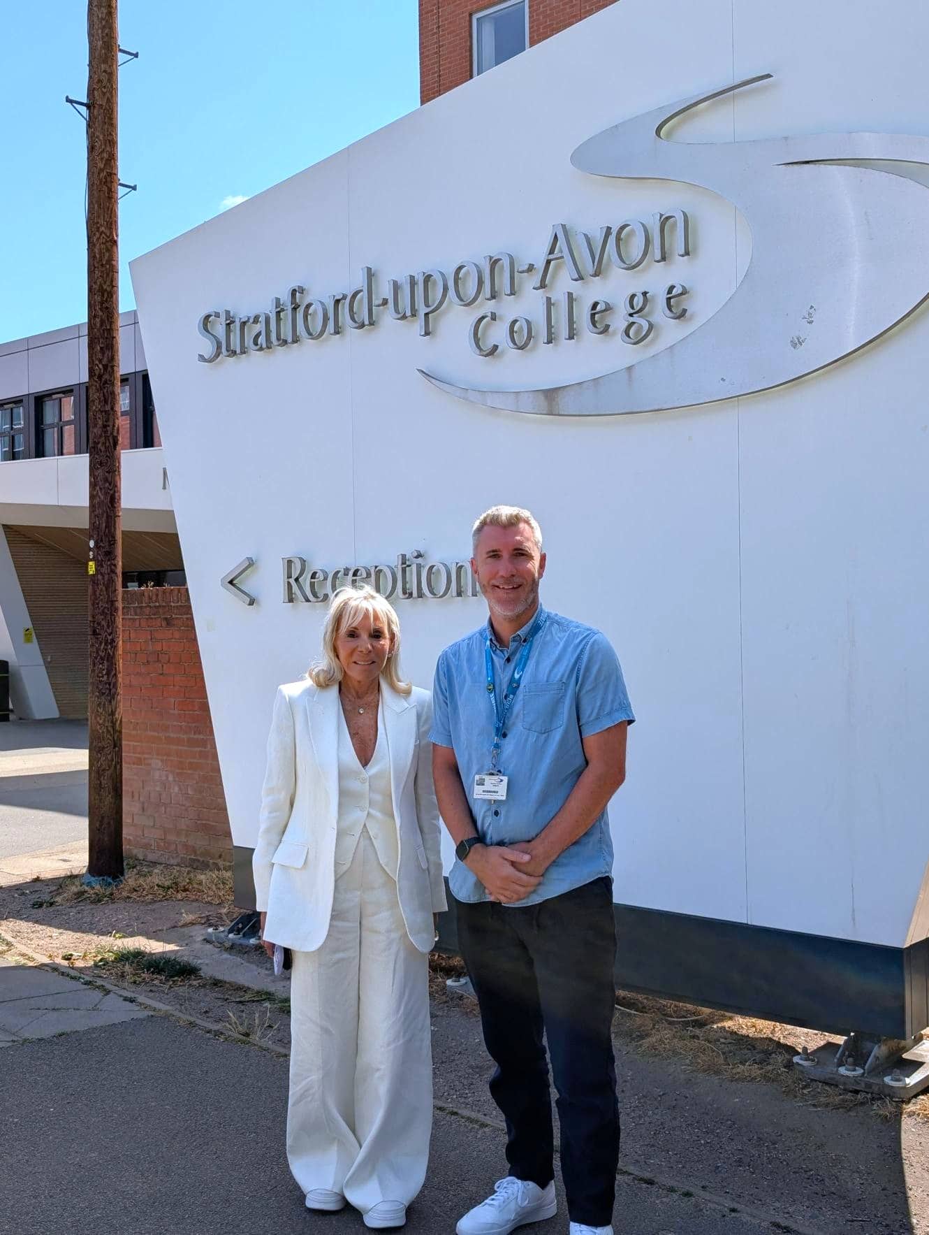 Linda and Thomas outside the college